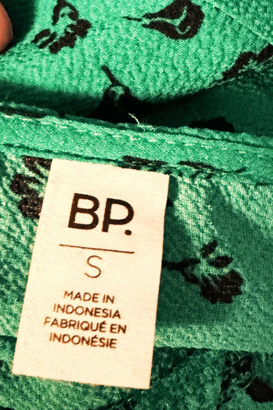 BP clothing label on green floral fabric, size small, made in Indonesia