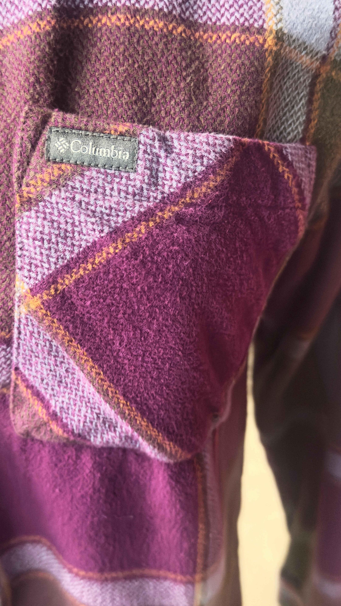 Columbia pink plaid flannel shirt close-up with front pocket and fabric tag