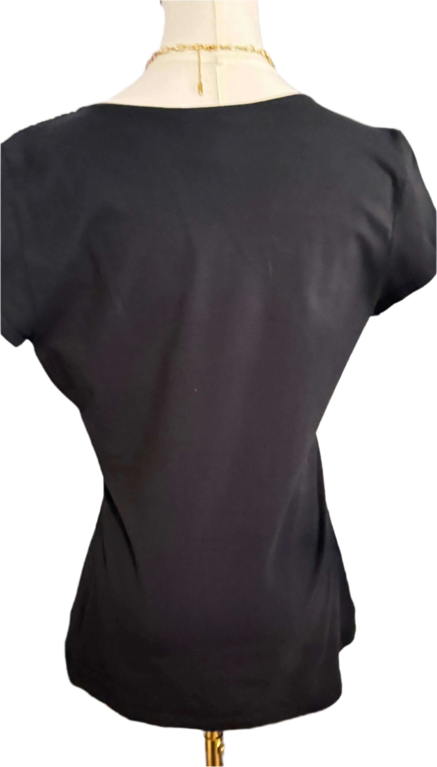 Back view of black short sleeve White House Black Market blouse on mannequin