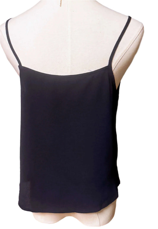 Back view of black sleeveless blouse with spaghetti straps on mannequin