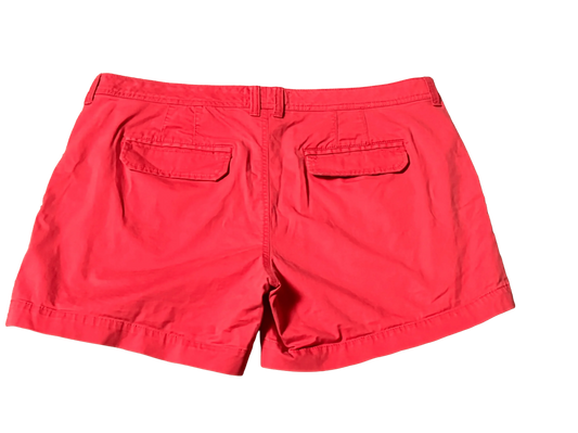 Old Navy red shorts back view with two flap pockets and belt loops on black background