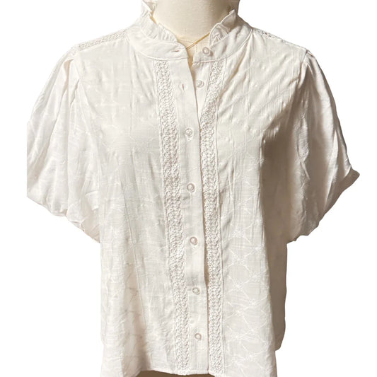 White short sleeve blouse with embroidered pattern and decorative front buttons