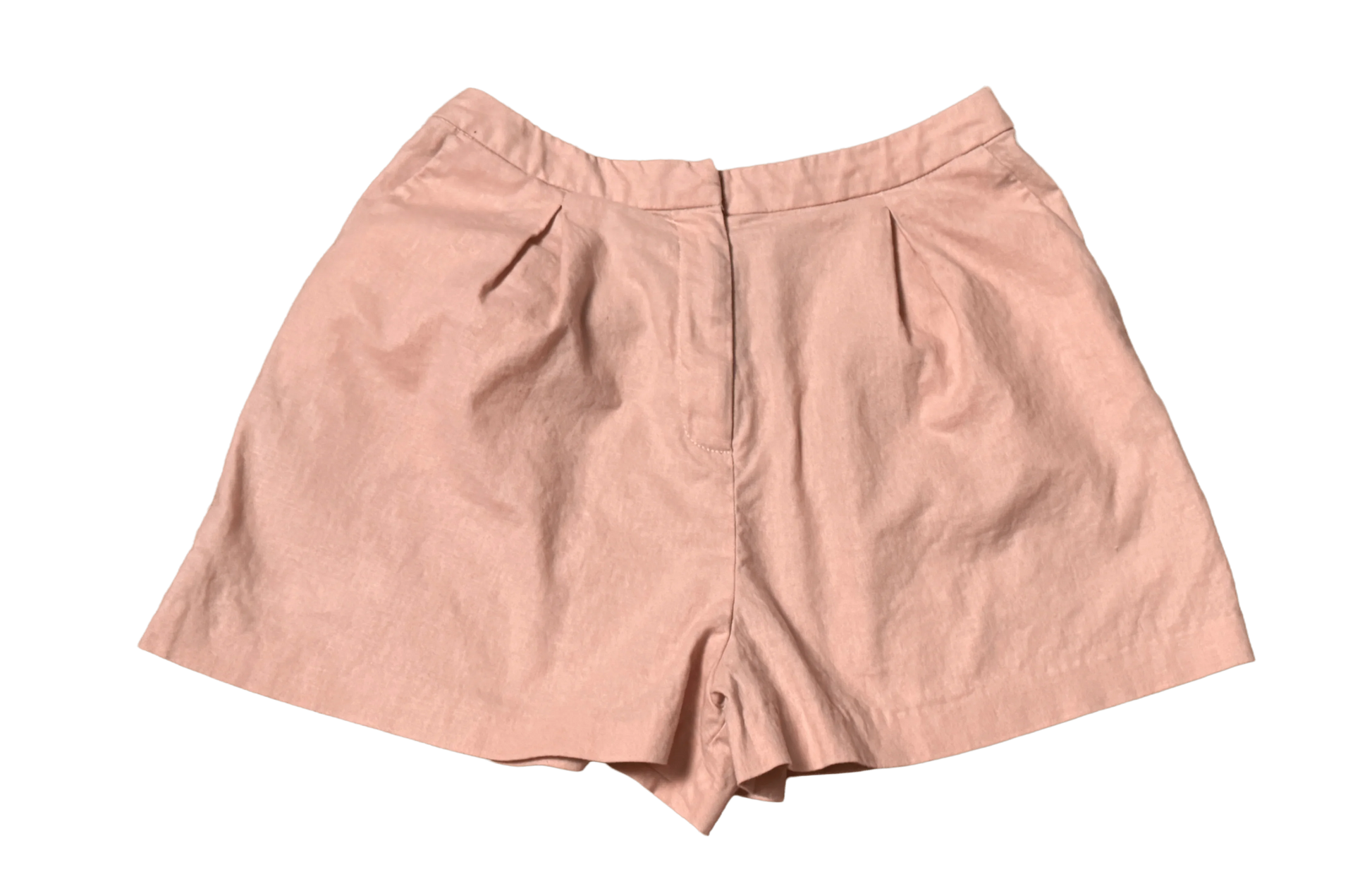 Light pink ASOS women’s high-waisted shorts with pleats, flat lay on black background