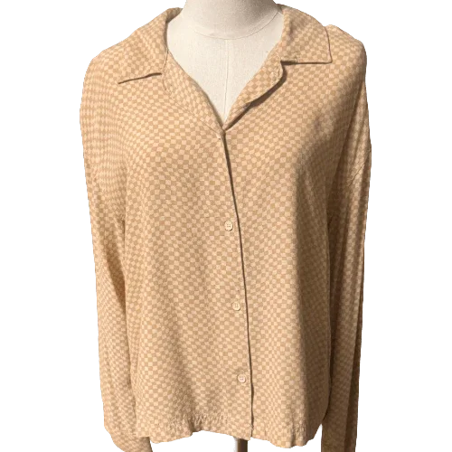 Beige Vans checkered long sleeve blouse displayed on mannequin