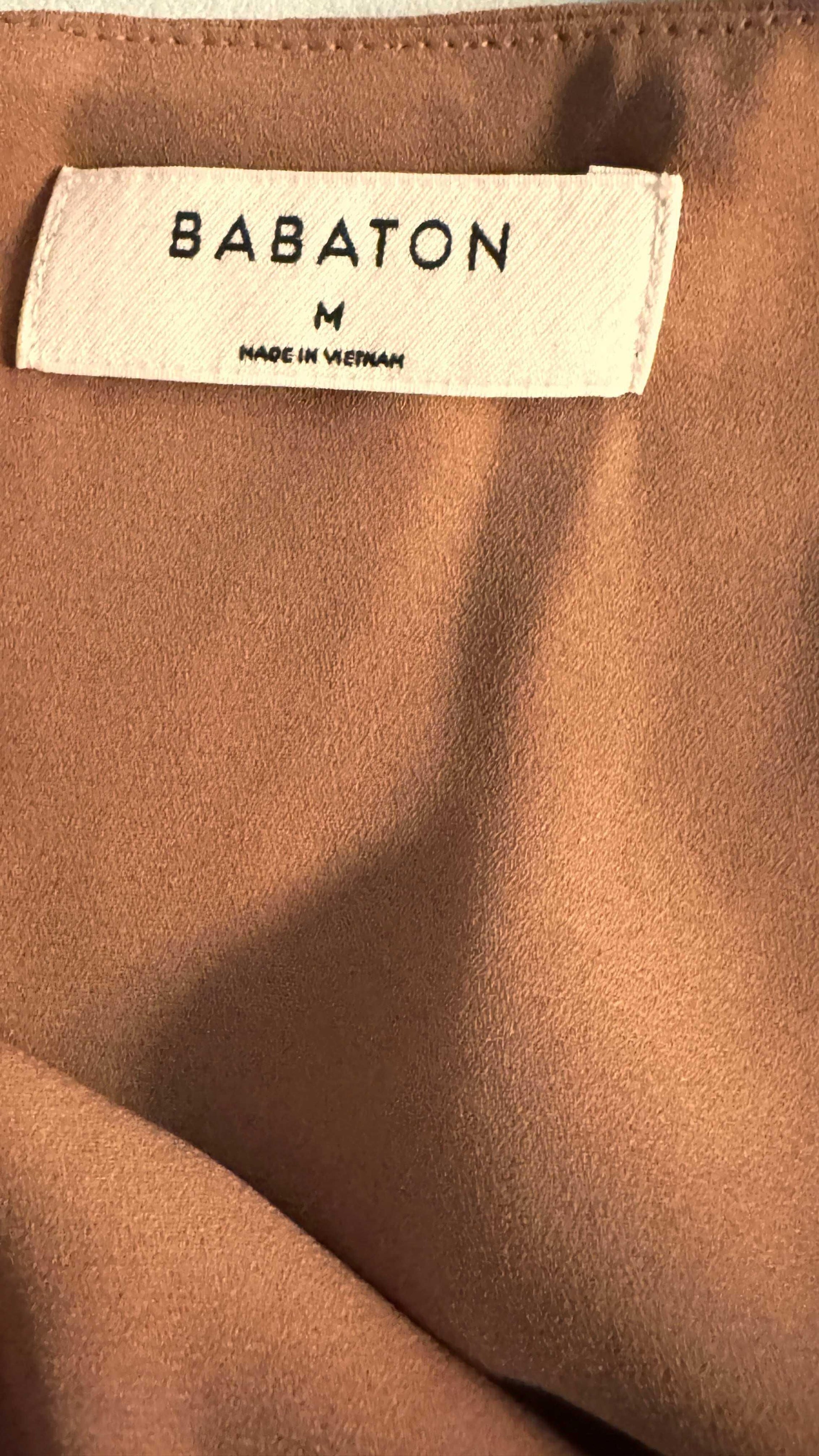 Babaton brown blouse close-up with fabric texture and size medium tag