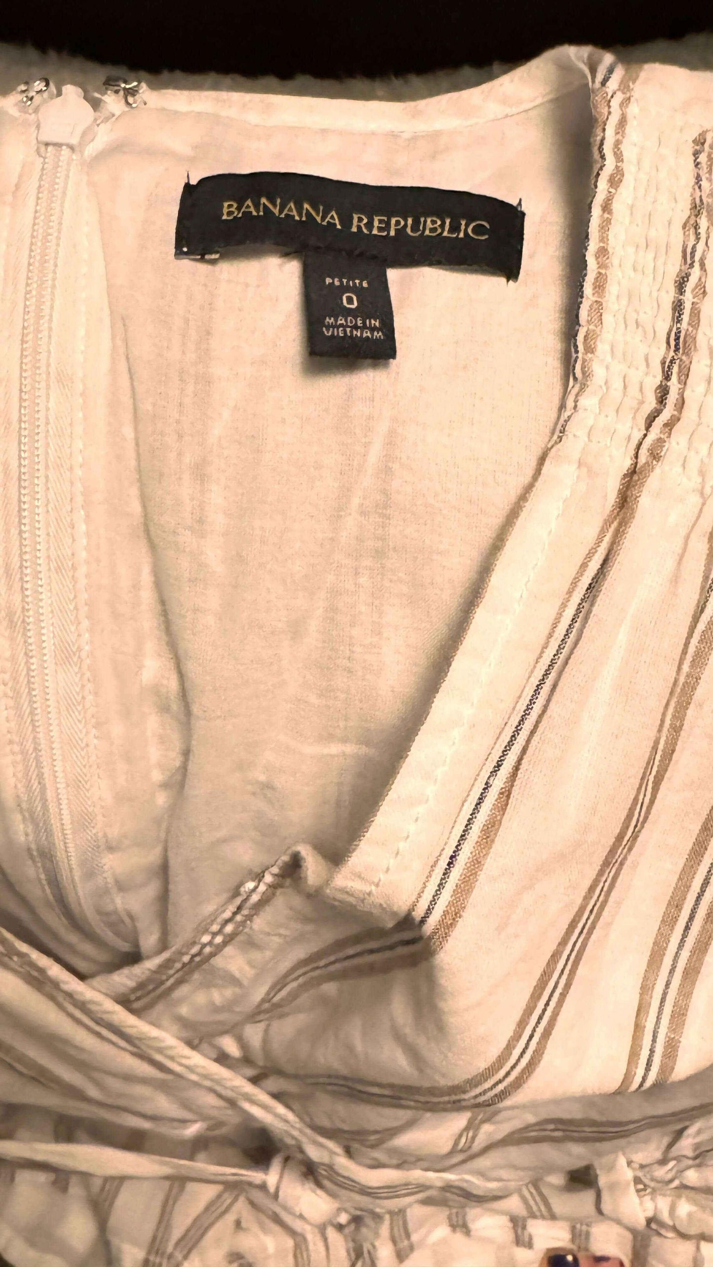 Banana Republic romper label, size 0 petite, beige fabric with tan stripes and zipper detail