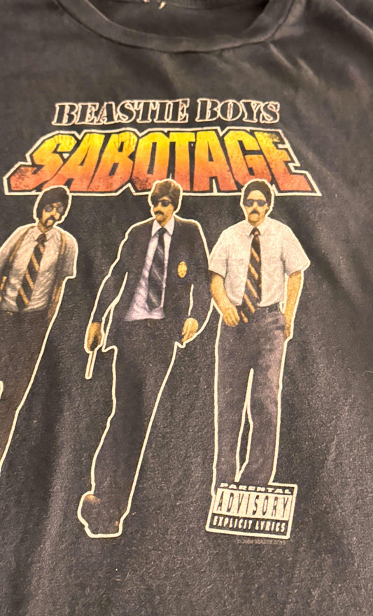 Vintage Beastie Boys Sabotage t-shirt with graphic of three men in retro police outfits