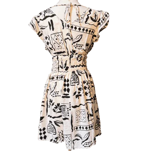 Blu Pepper black and white dress back view, abstract print, short sleeves, cinched waist