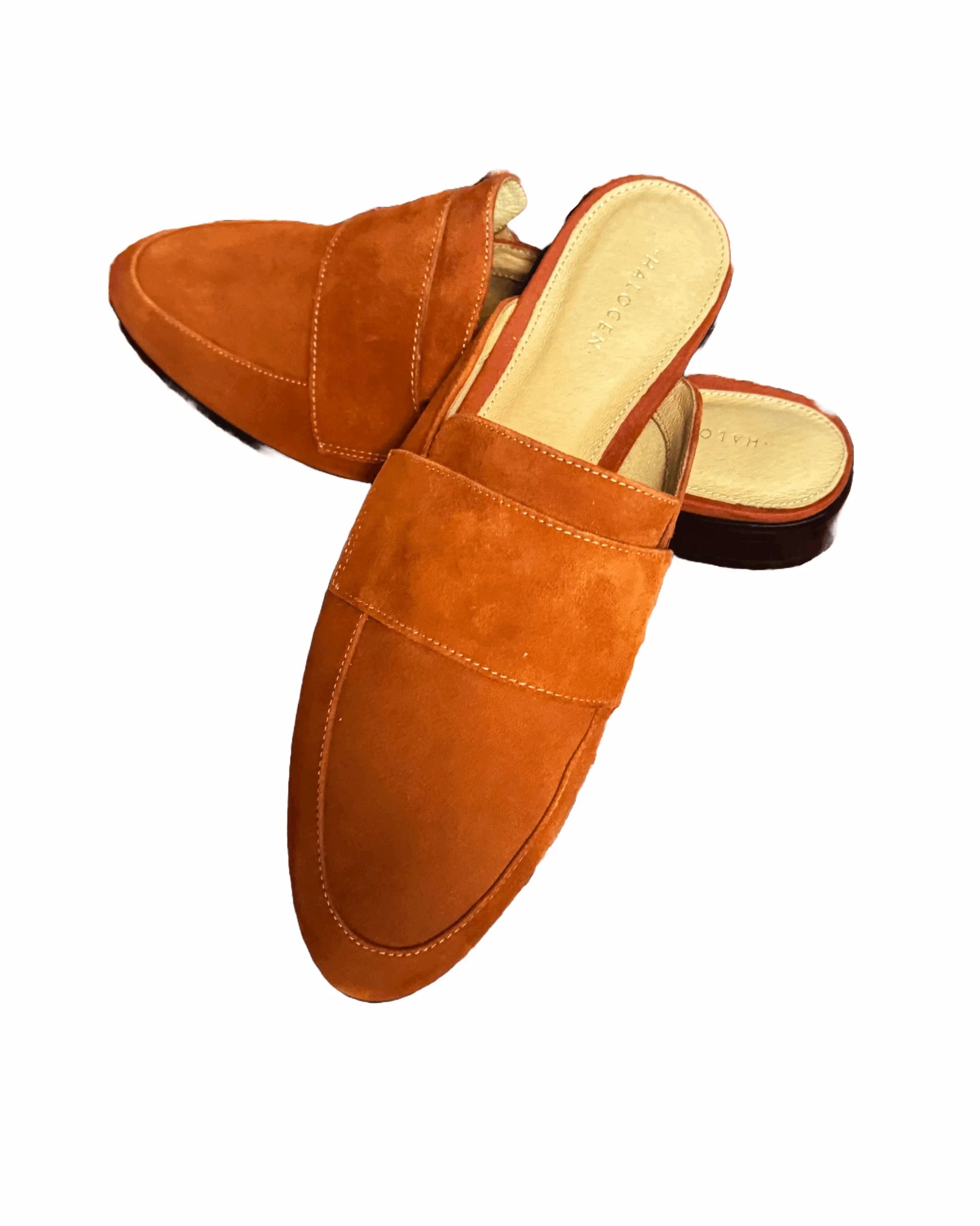 Burnt orange suede mules for women by Halogen, slip-on flat shoes on white background