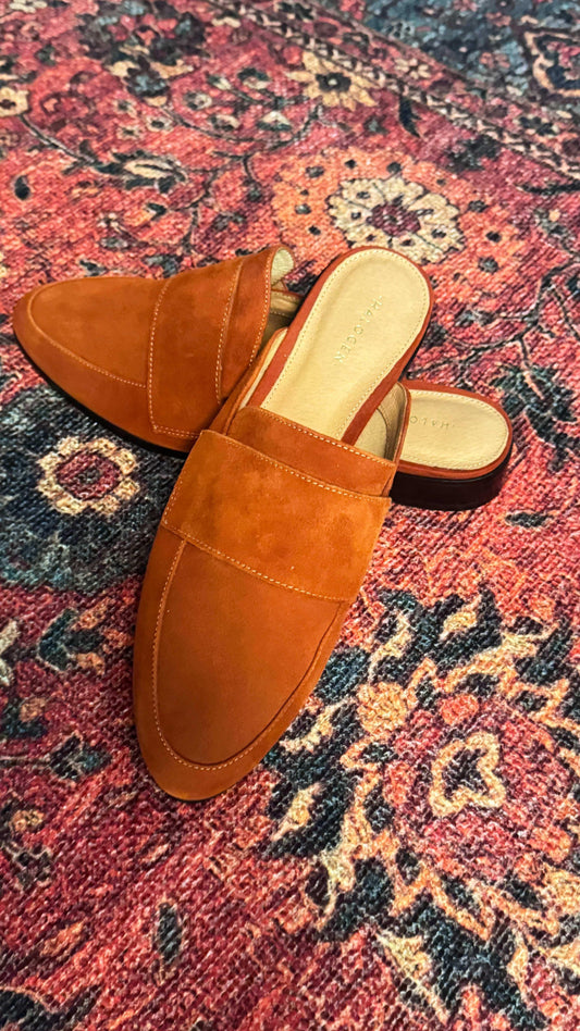 Burnt orange suede Nordstrom mules for women by Halogen on a patterned rug