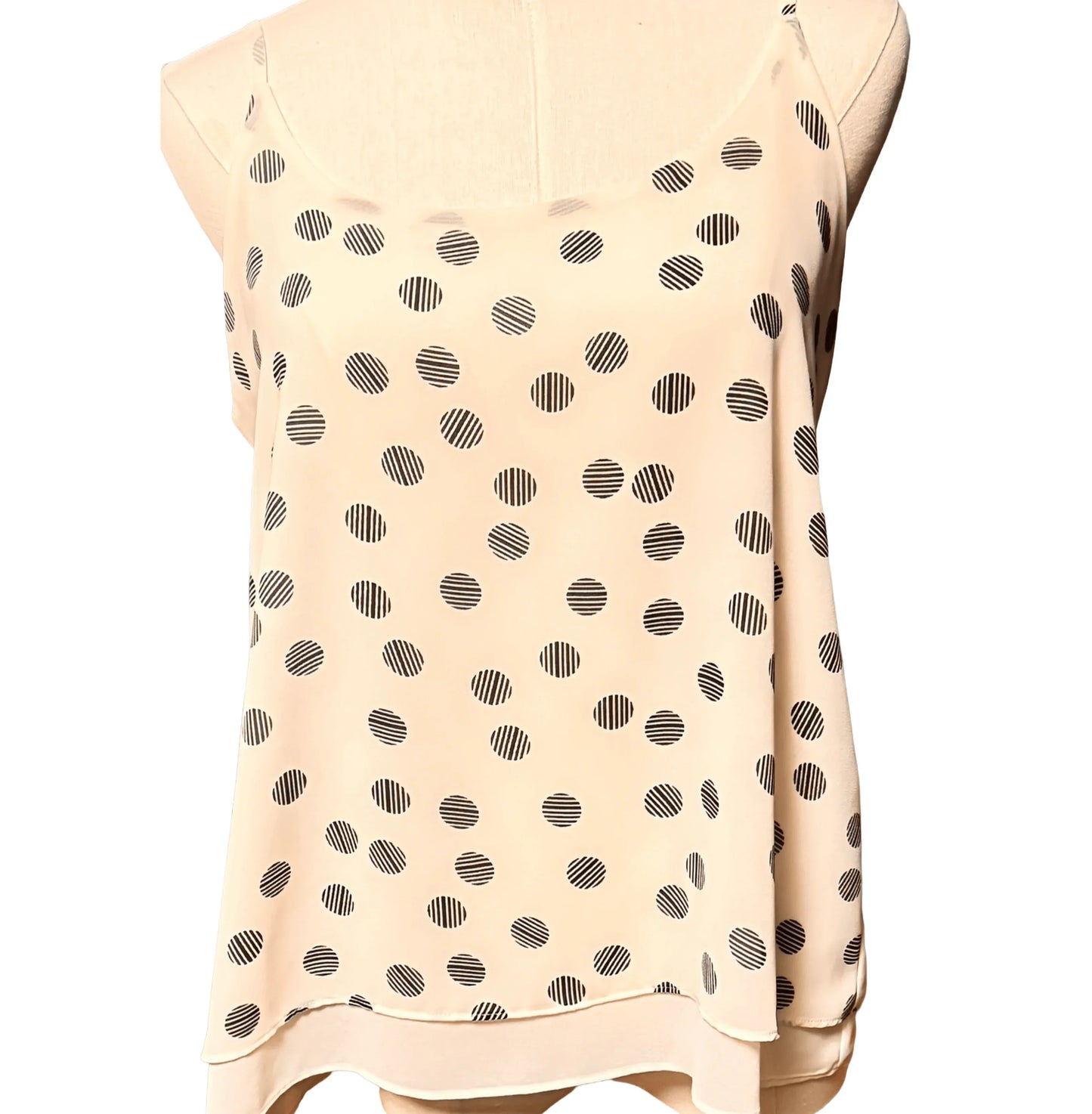 Cynthia Rowley light beige sleeveless blouse with black polka dot pattern on mannequin