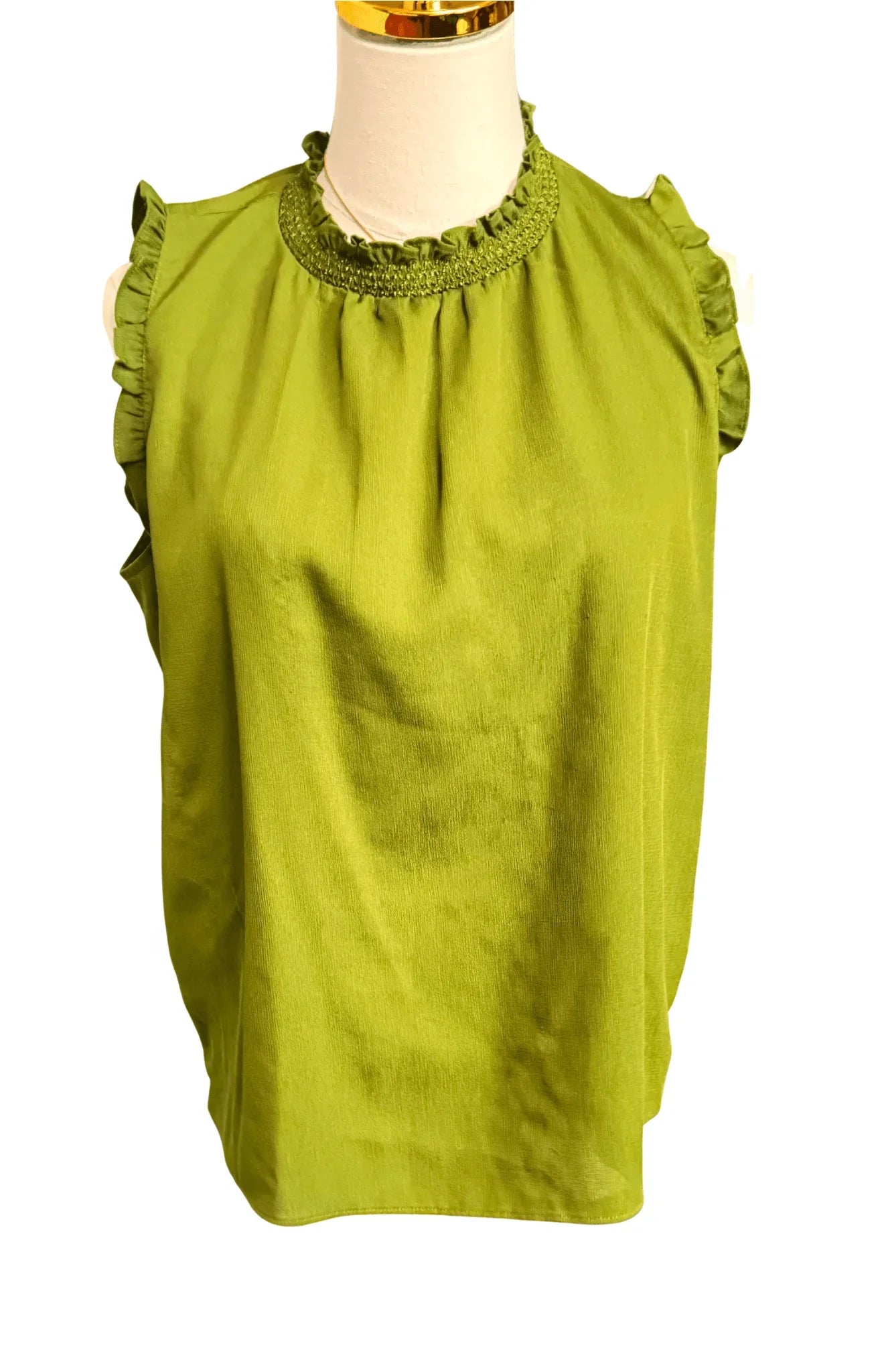 Sleeveless green blouse with ruffled collar and armholes on mannequin