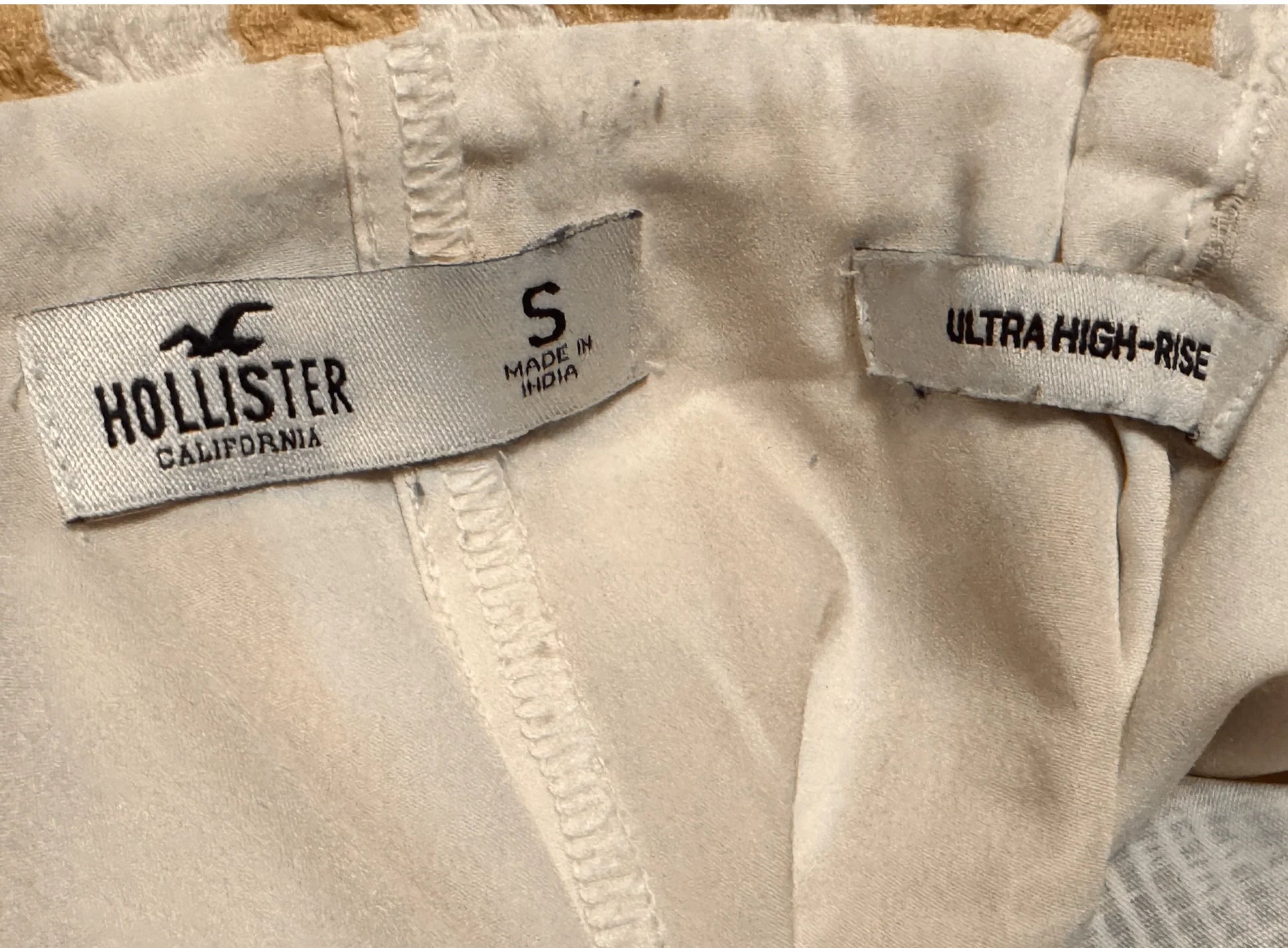 Hollister California skirt label, size small, ultra high-rise, made in India, beige fabric