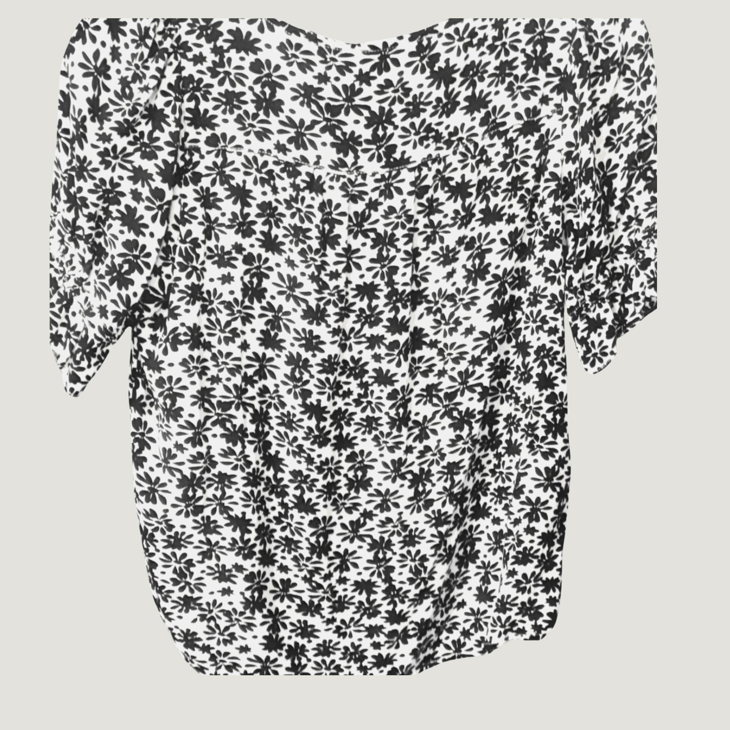 White blouse with black floral print and half sleeves, back view on plain background