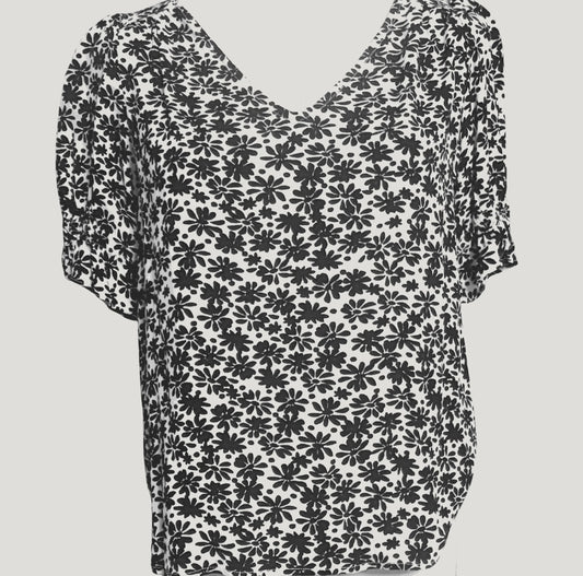 White V-neck blouse with black floral pattern and short sleeves