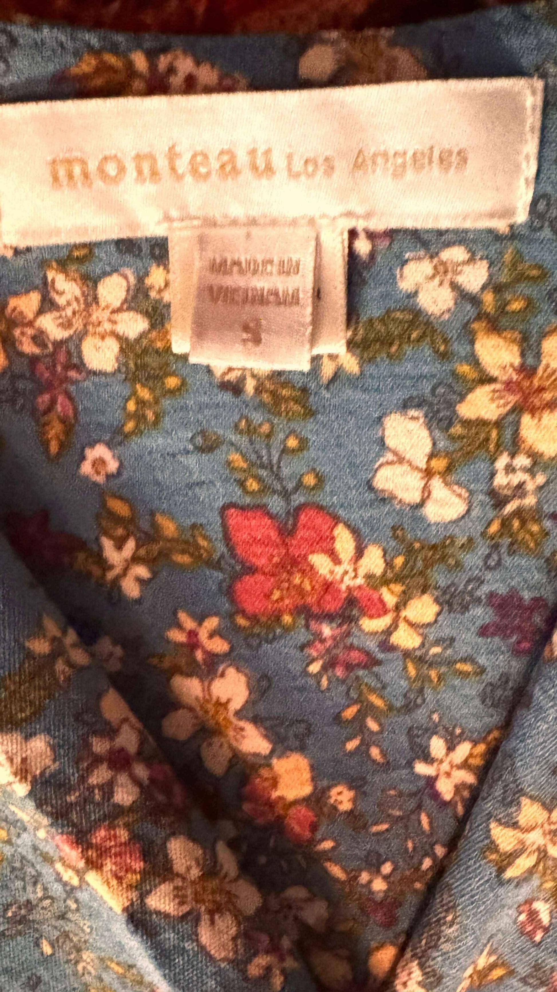 Monteau Los Angeles floral dress label on blue fabric with colorful flower print