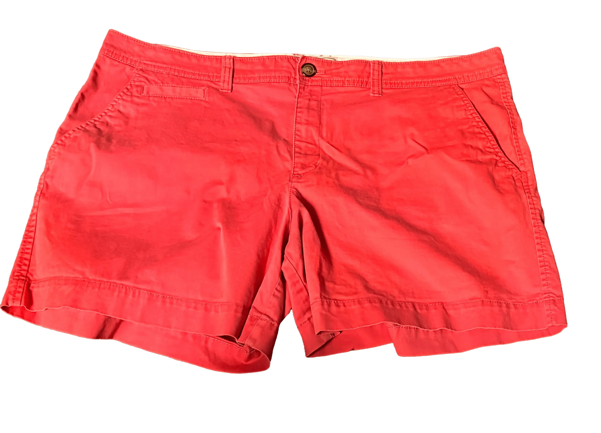 Old Navy red shorts with button closure and front pockets, isolated on black background