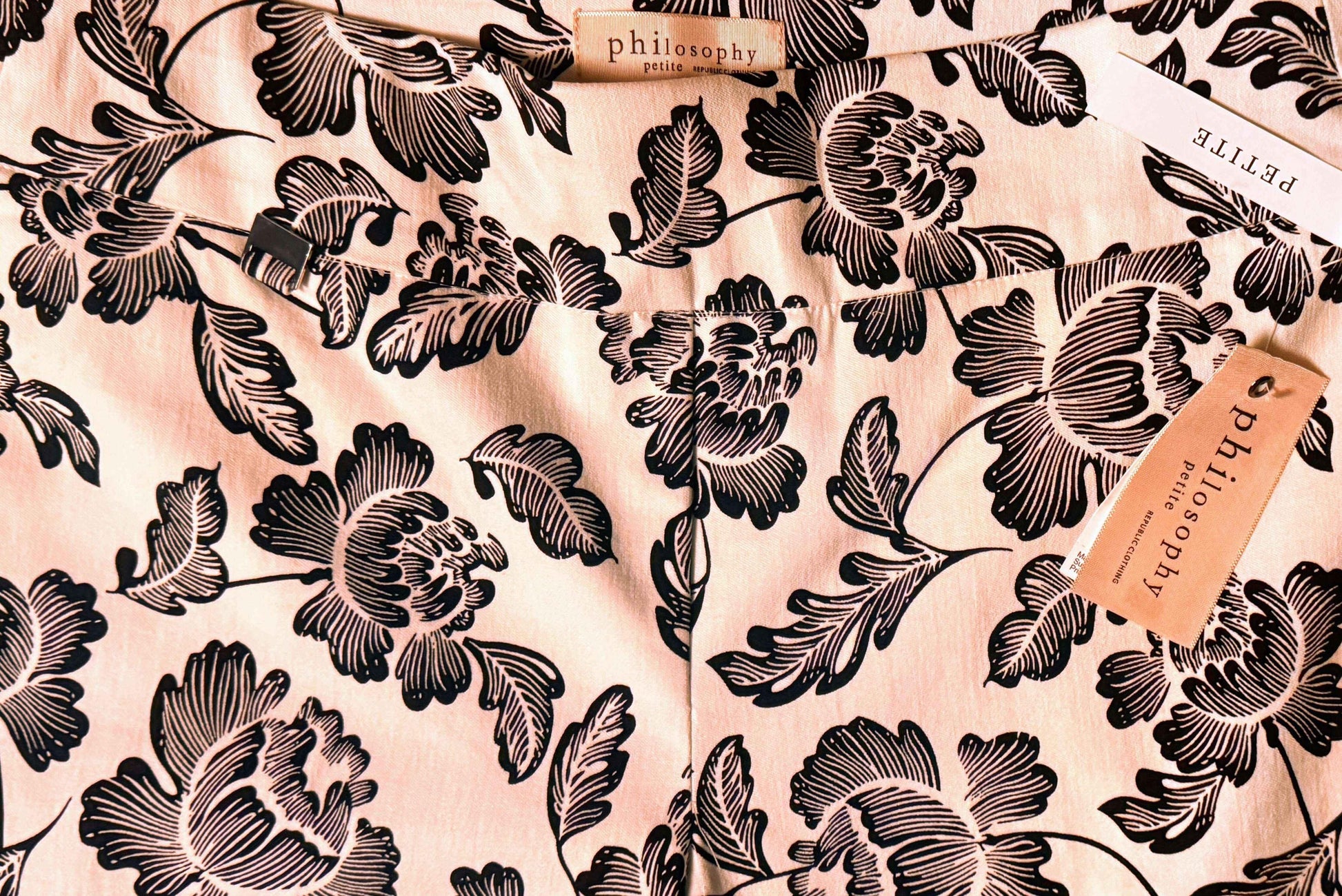 Philosophy petite printed pants with black floral pattern on light fabric and brand tags