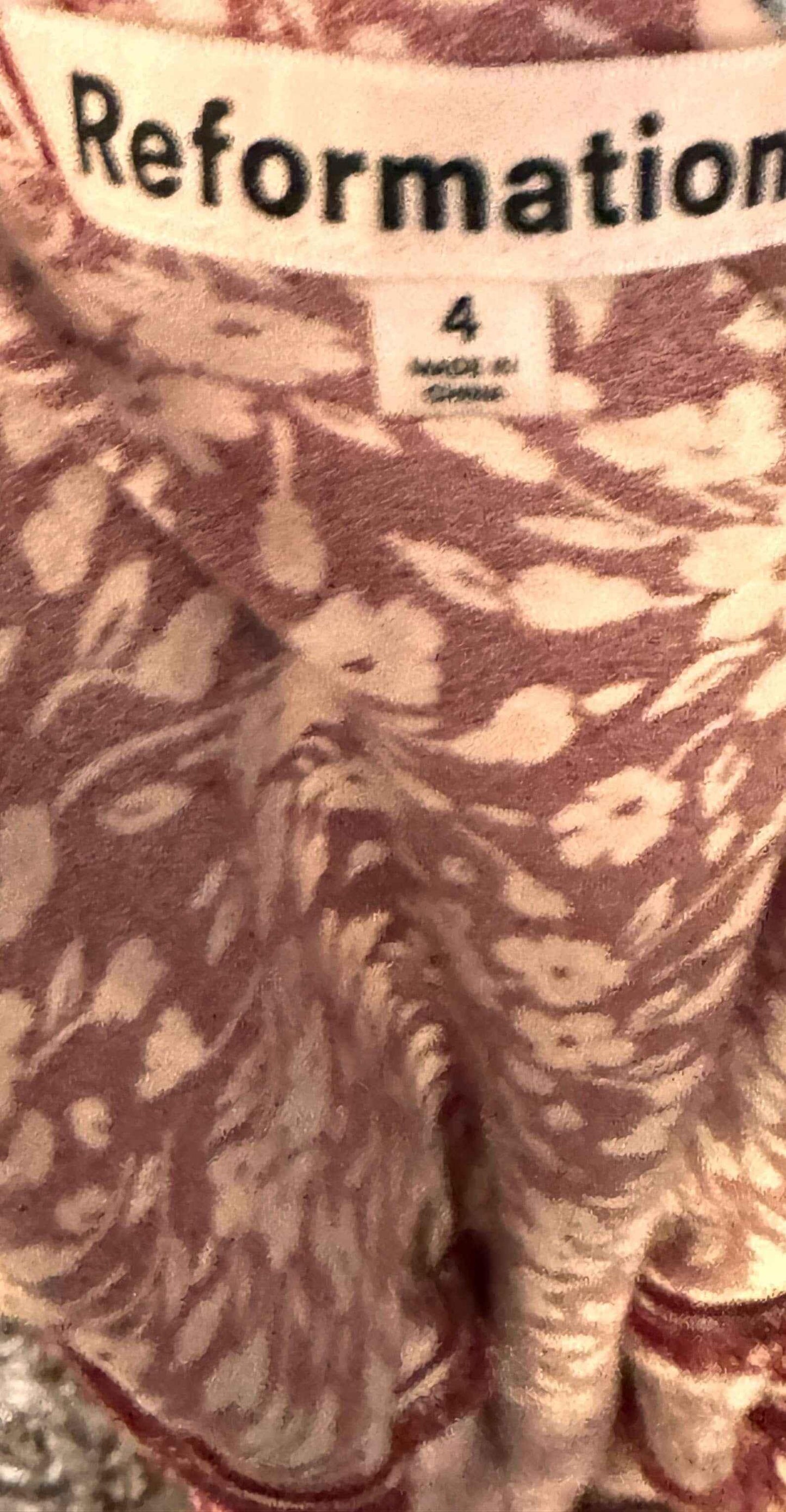 Reformation red floral dress fabric and clothing tag with size 4 label