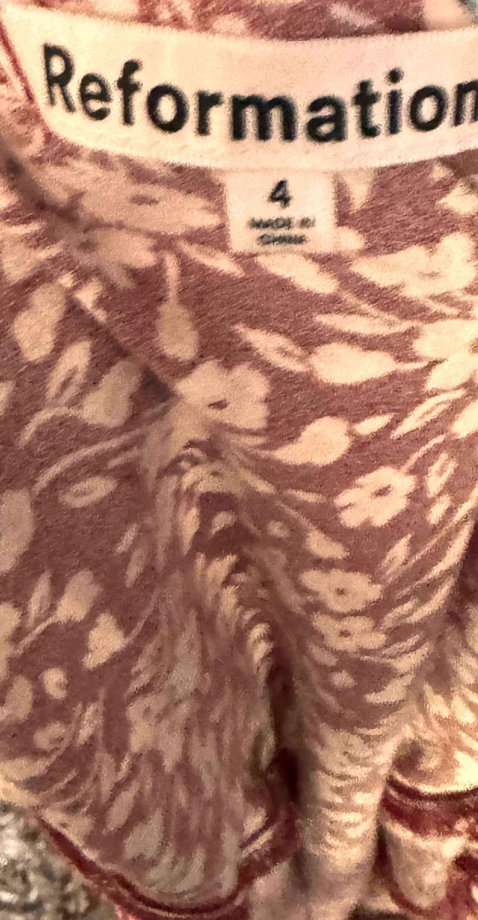 Reformation red floral dress fabric and clothing tag with size 4 label