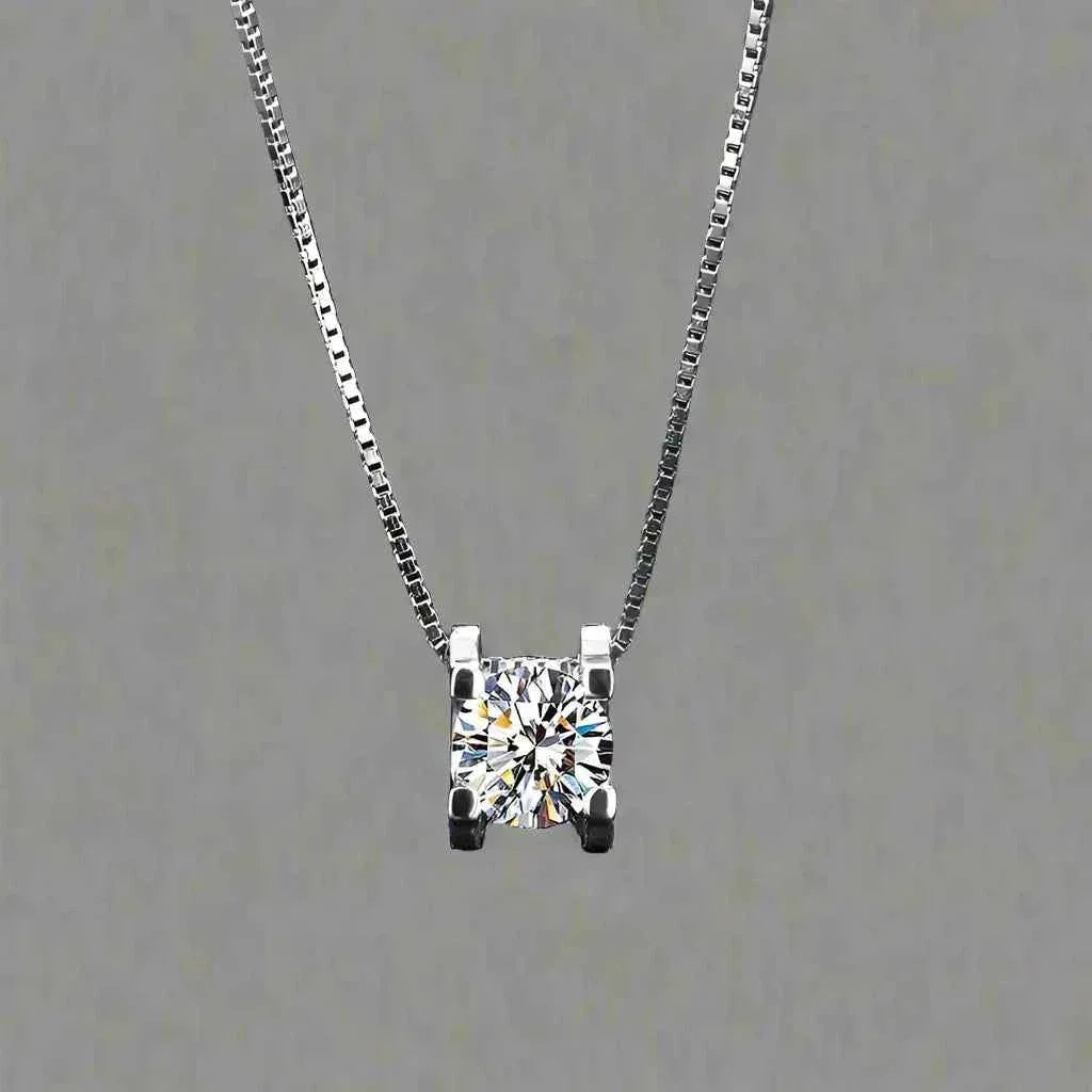 Simple sterling silver moissanite pendant necklace with rhombus design on gray background