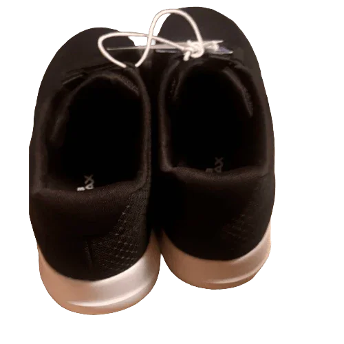 Pair of Skechers black walking shoes with white soles, viewed from the back.