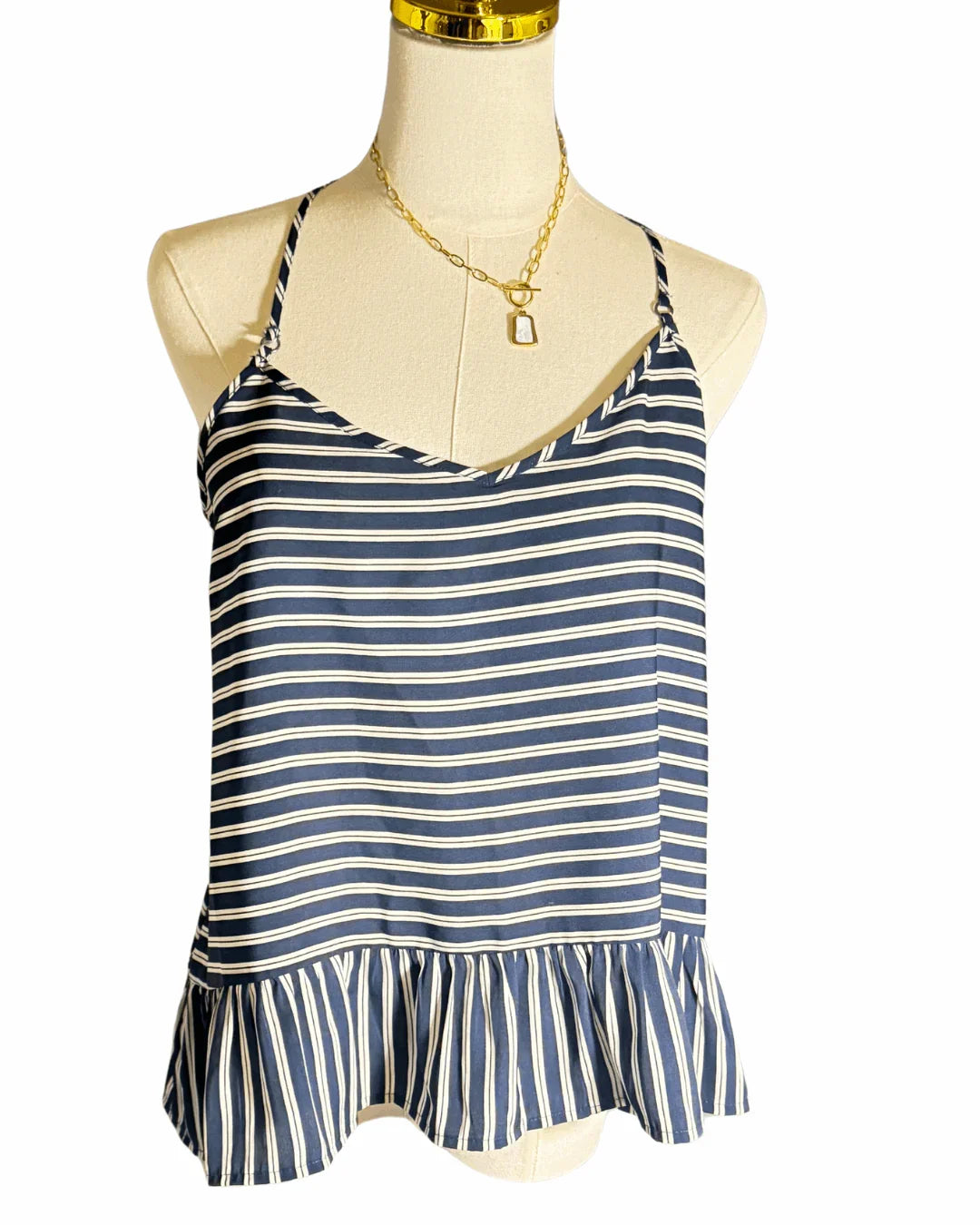 Navy blue and white striped camisole top with ruffle hem on mannequin