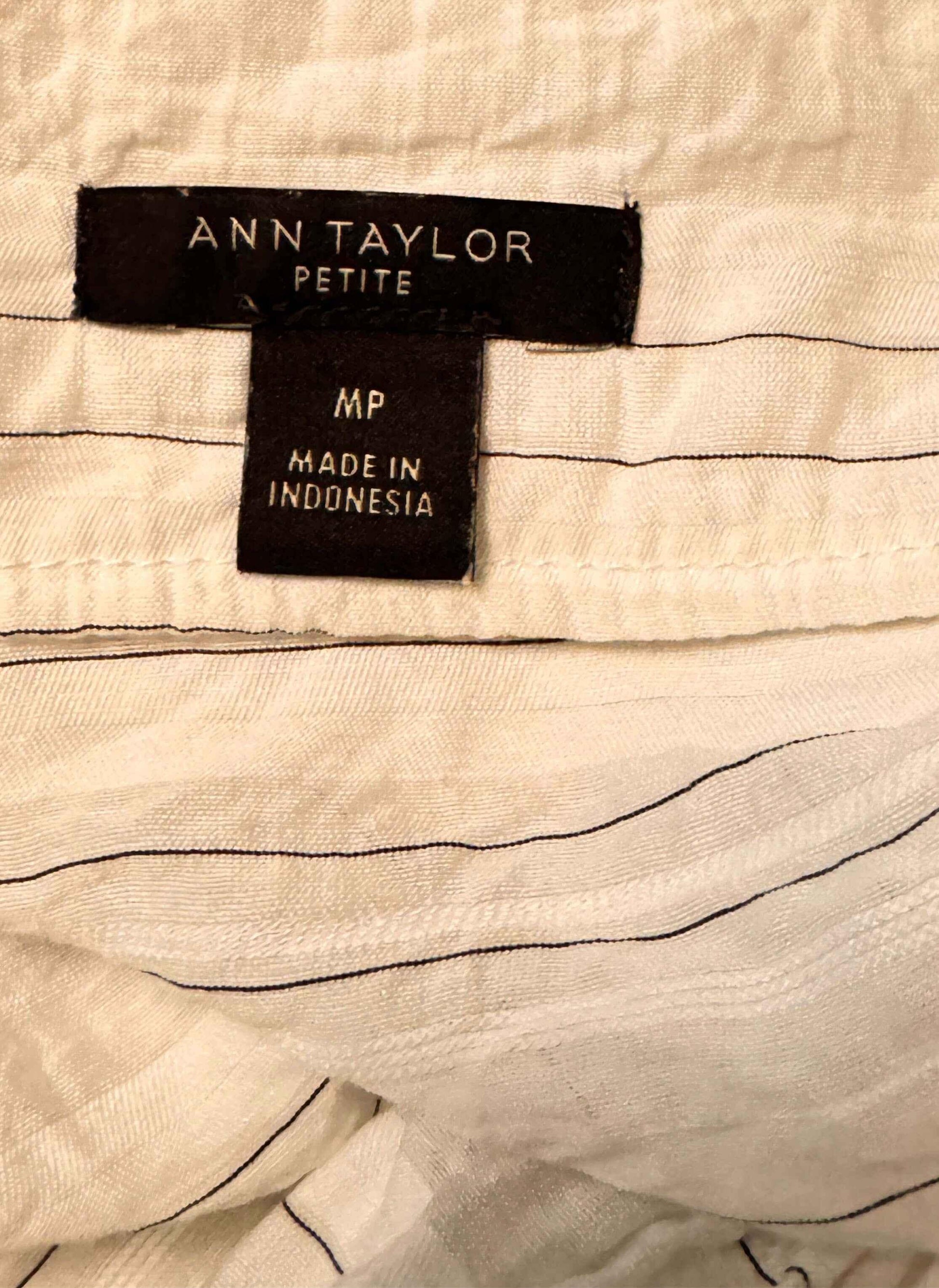 Ann Taylor Petite blouse label, MP size, made in Indonesia, on white fabric with stripes