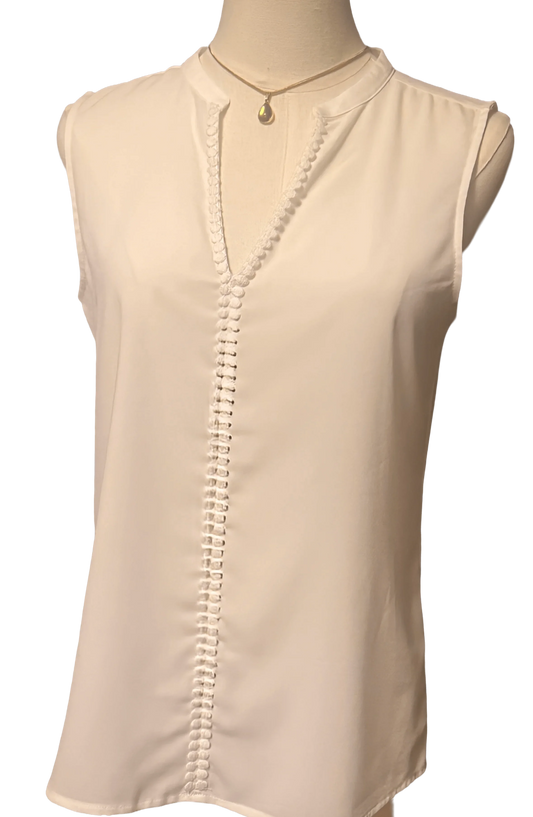 White Banana Republic sleeveless blouse with front buttons on mannequin