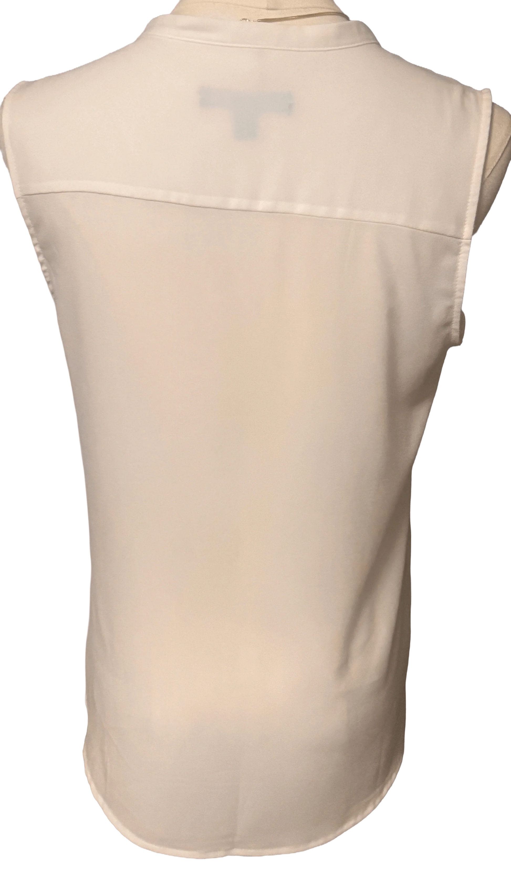 Back view of sleeveless white Banana Republic blouse on mannequin