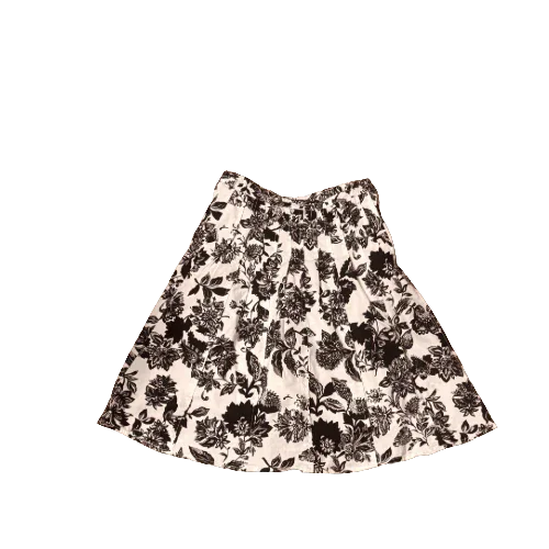 Black and white Talbots skirt with floral pattern on white background