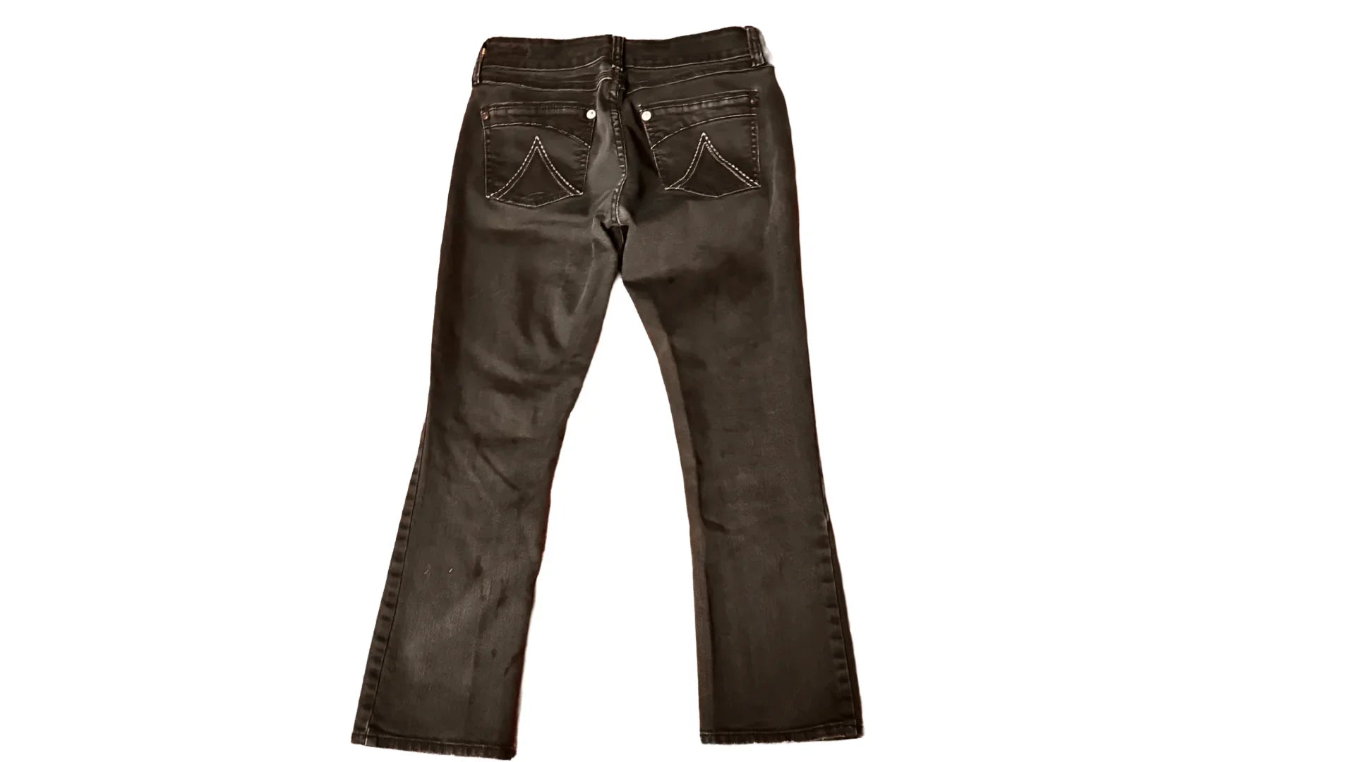 black denim jeans backside with stitched pockets on white background