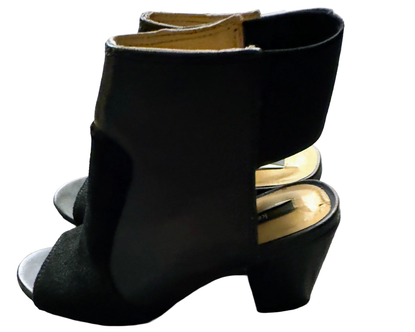 Black peep-toe block heel sandals with open back on a plain background