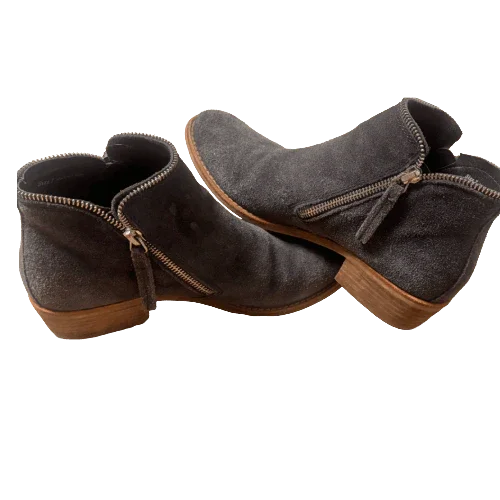 Gray suede ankle boots with wooden soles and side zippers on a white background