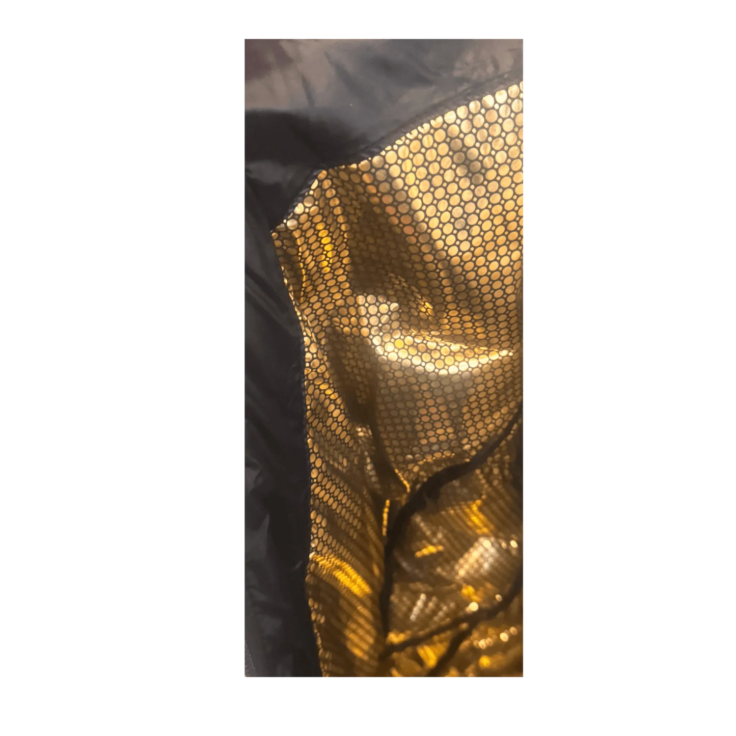 Closeup of Columbia jacket gold thermal reflective lining with honeycomb pattern