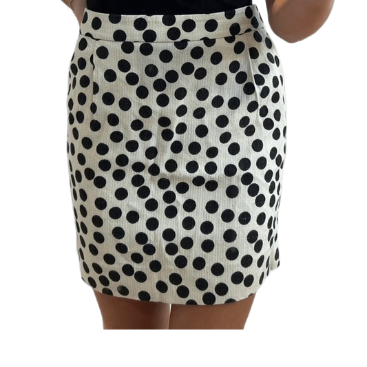 Cream skirt with bold black polka dots, knee-length, stylish women's fashion