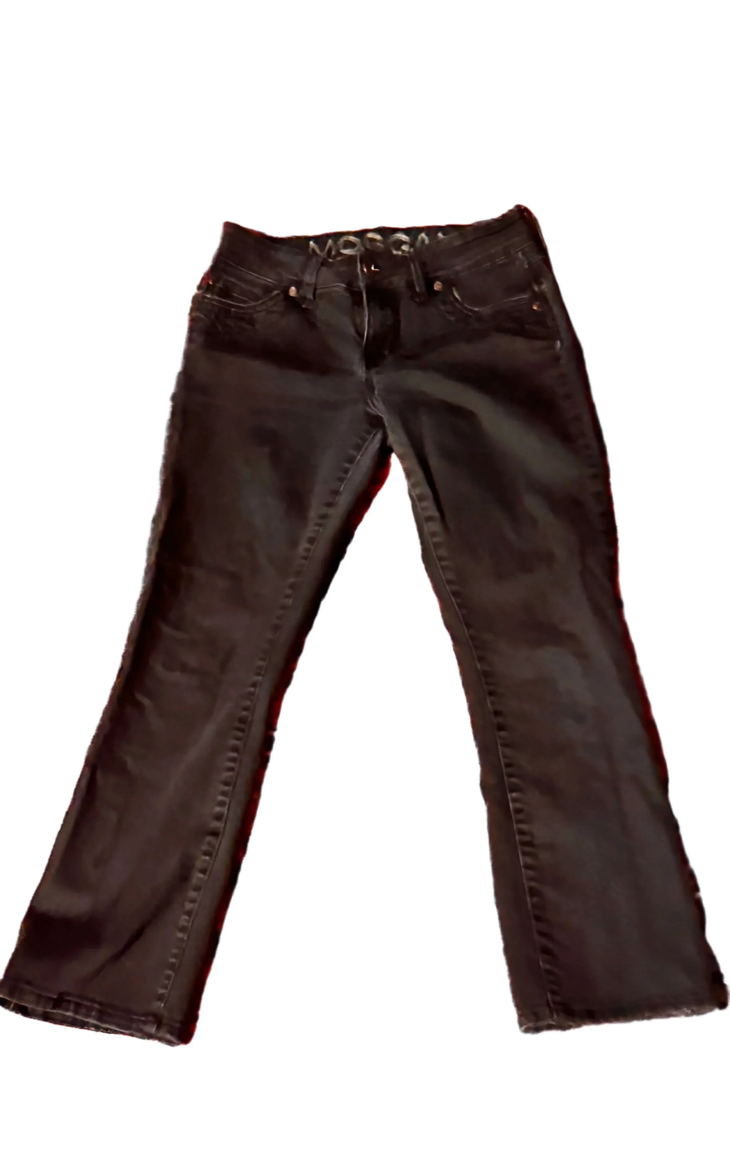 Black denim jeans laid flat on white background, front view, casual fashion pants