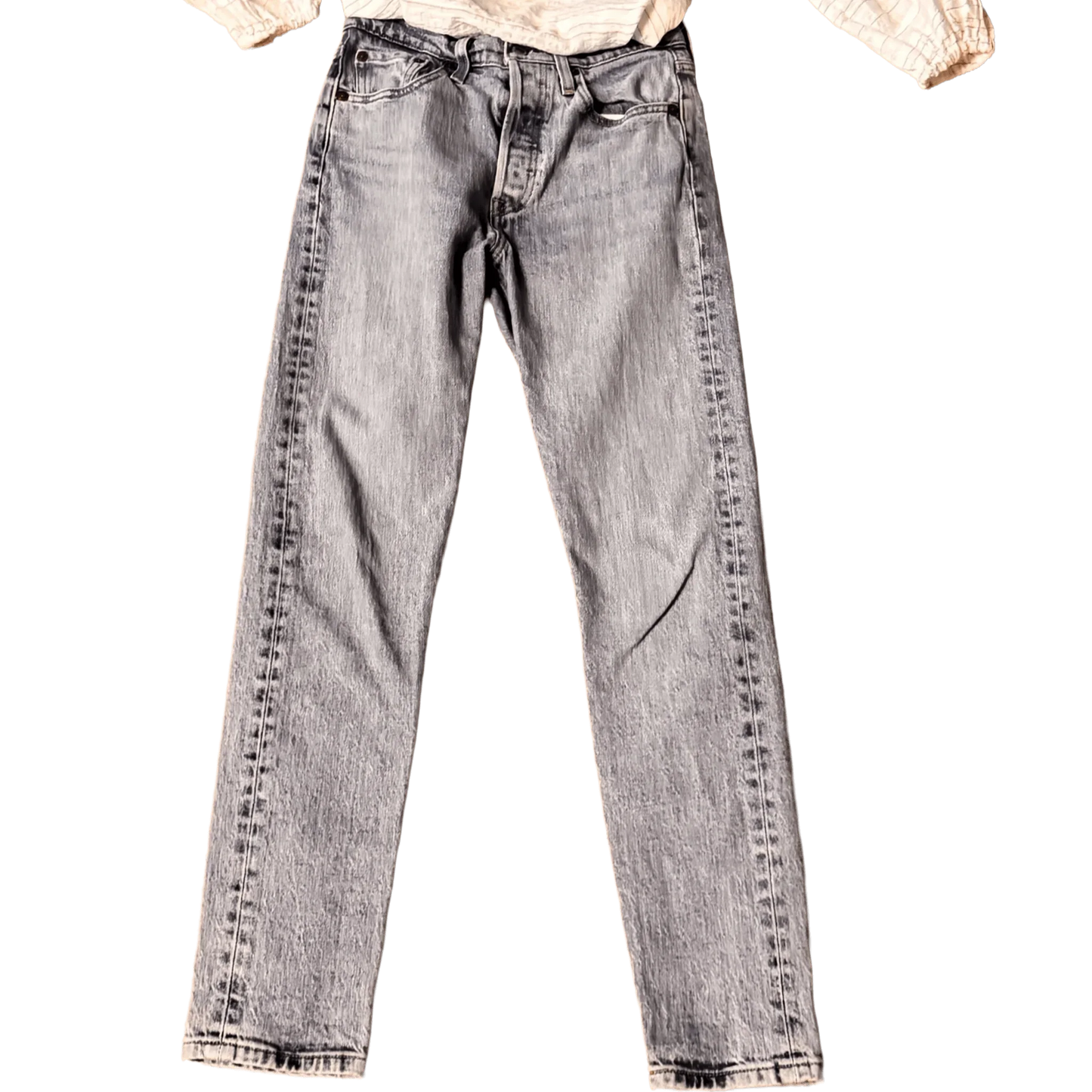 Front of classic light wash Levi's jeans with button fly on black background