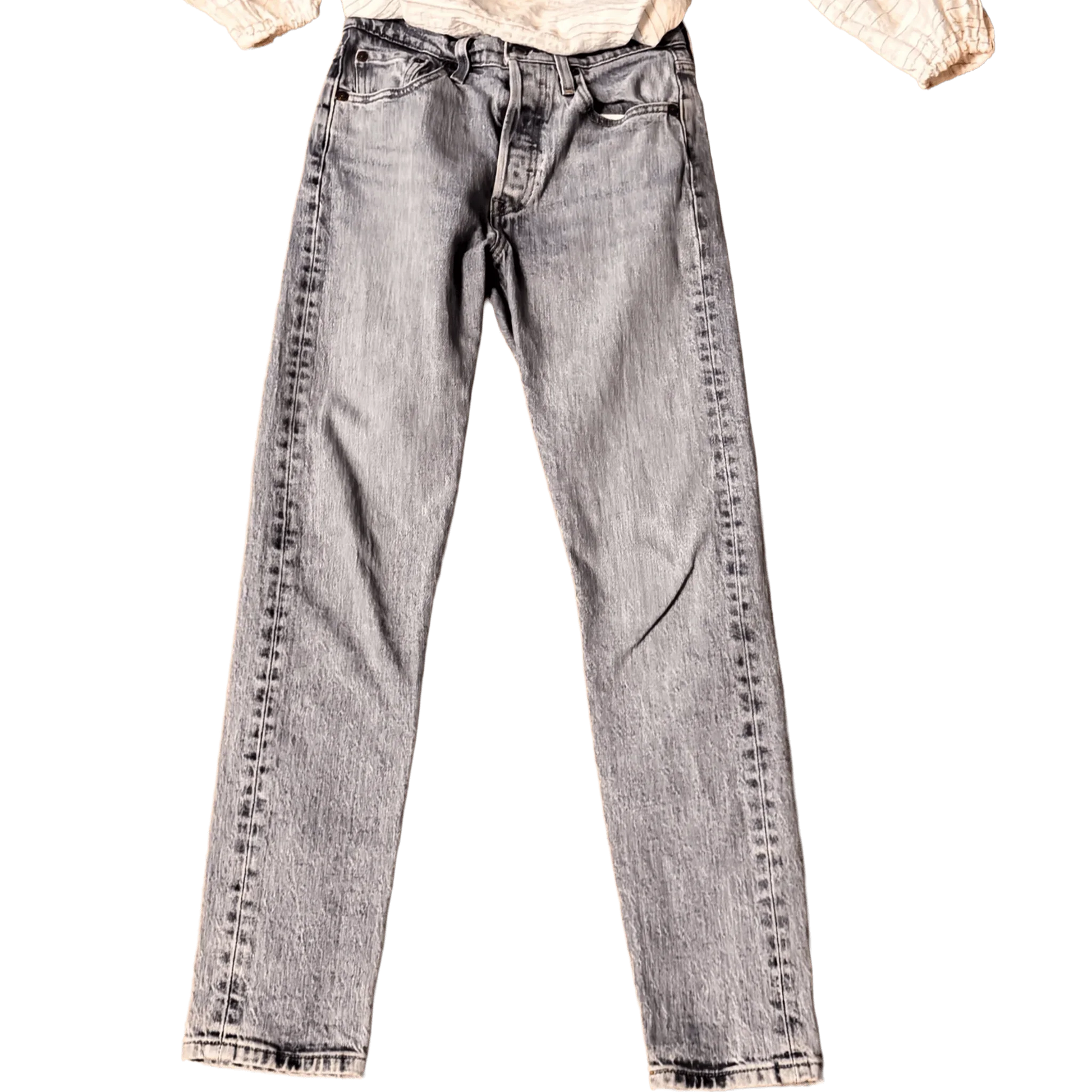 Front of classic light wash Levi's jeans with button fly on black background