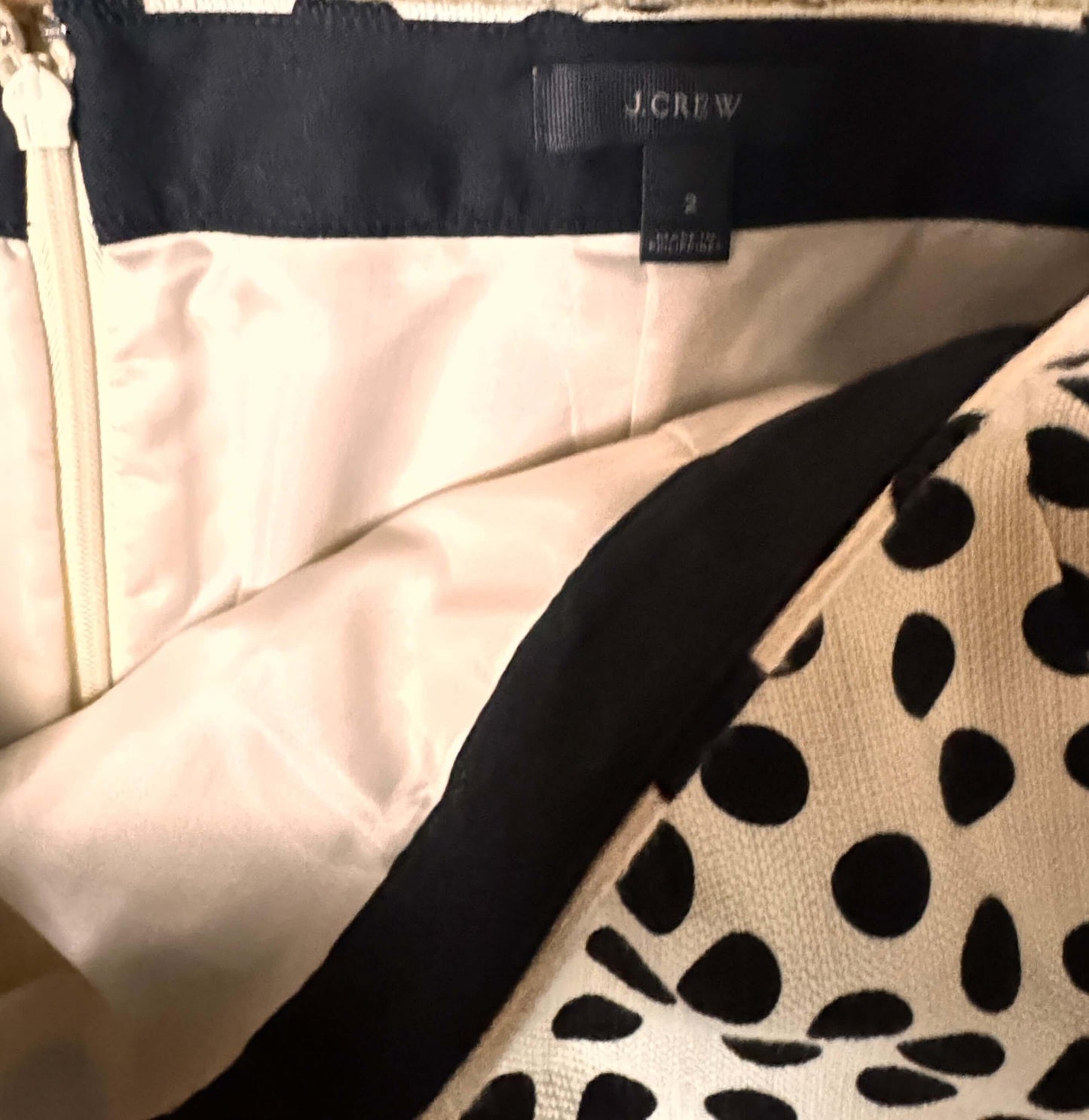 J.Crew polka dot skirt size 2 with brand label, zipper, and white lining visible
