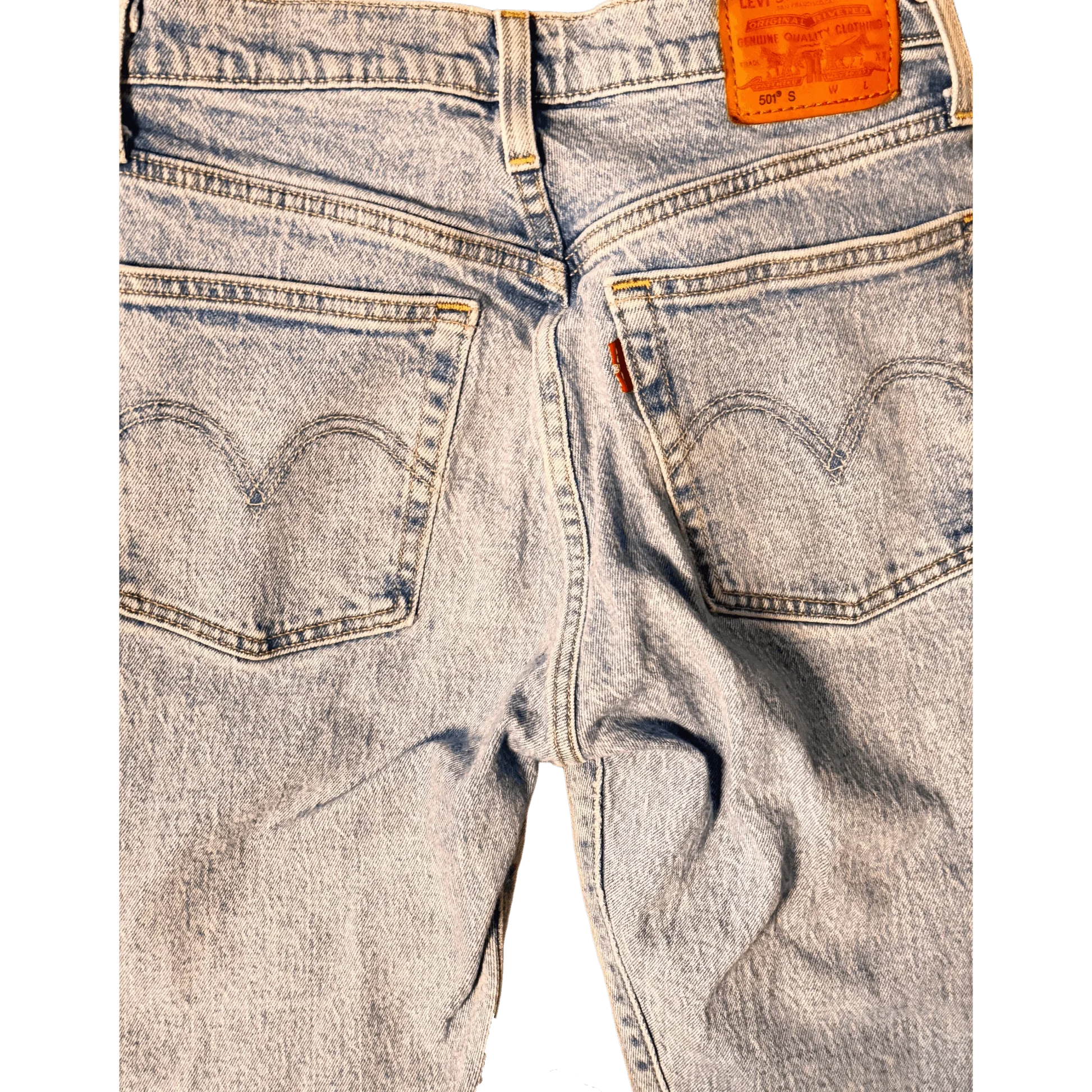 Close-up of Levi's light blue denim jeans back pockets and leather patch