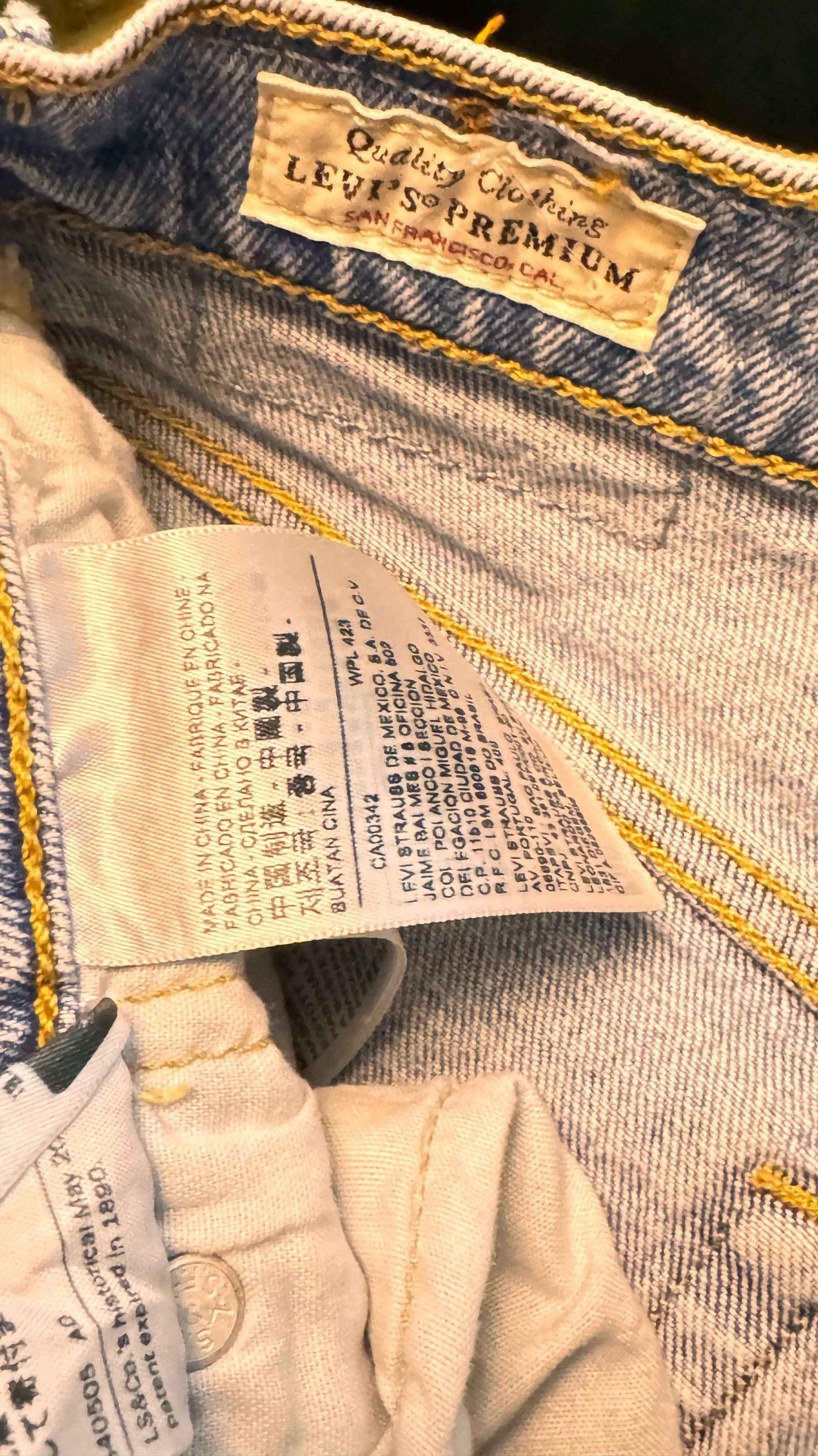 Levi's Premium jeans inner label with washing tags and yellow stitching detail