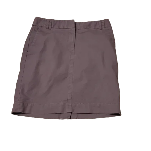 Loft mini skirt size 2 petite in solid mauve color, front view on white background