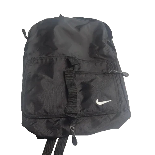 Black Nike athletic bag with front pocket and white swoosh logo on plain background