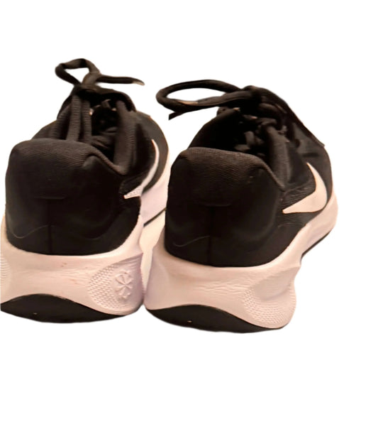 Back view of black and white Nike sneakers on white background
