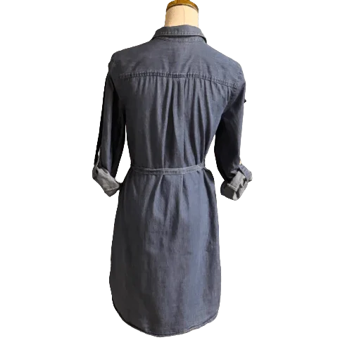 Back view of a blue denim Old Navy shirt dress with rolled sleeves on a mannequin