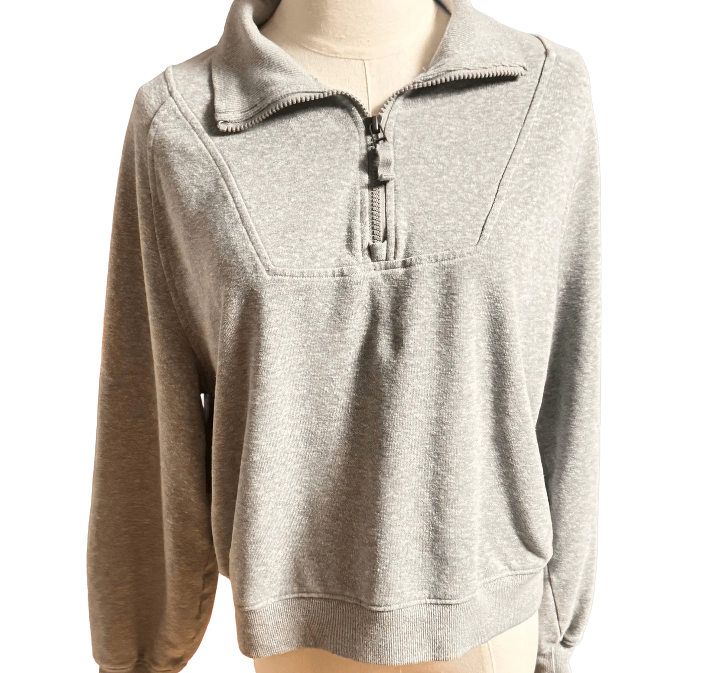 Gray pullover sweatshirt with quarter zip and collar, front view on mannequin