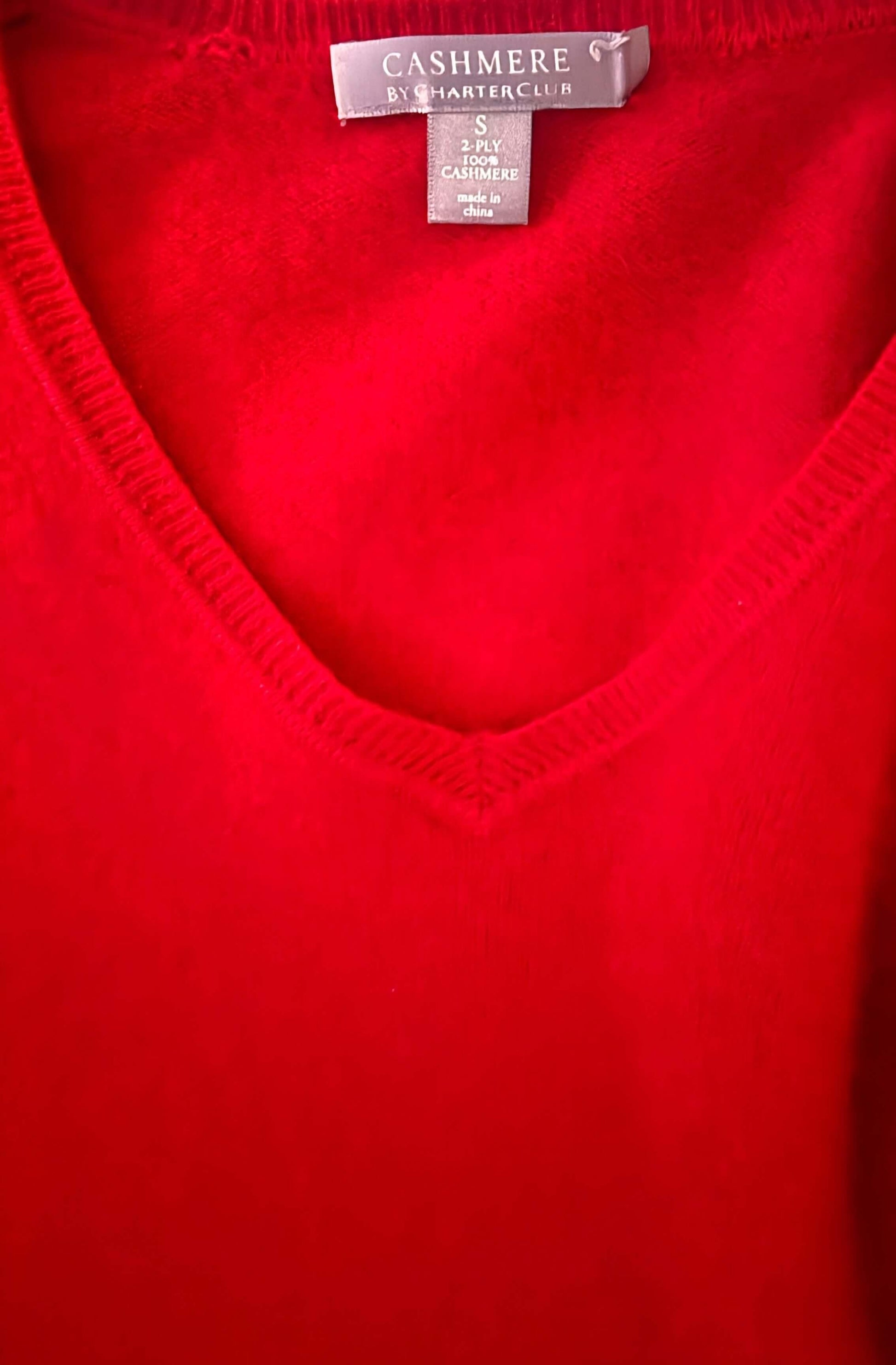Red cashmere V-neck sweater with visible Charter Club label and soft knit texture