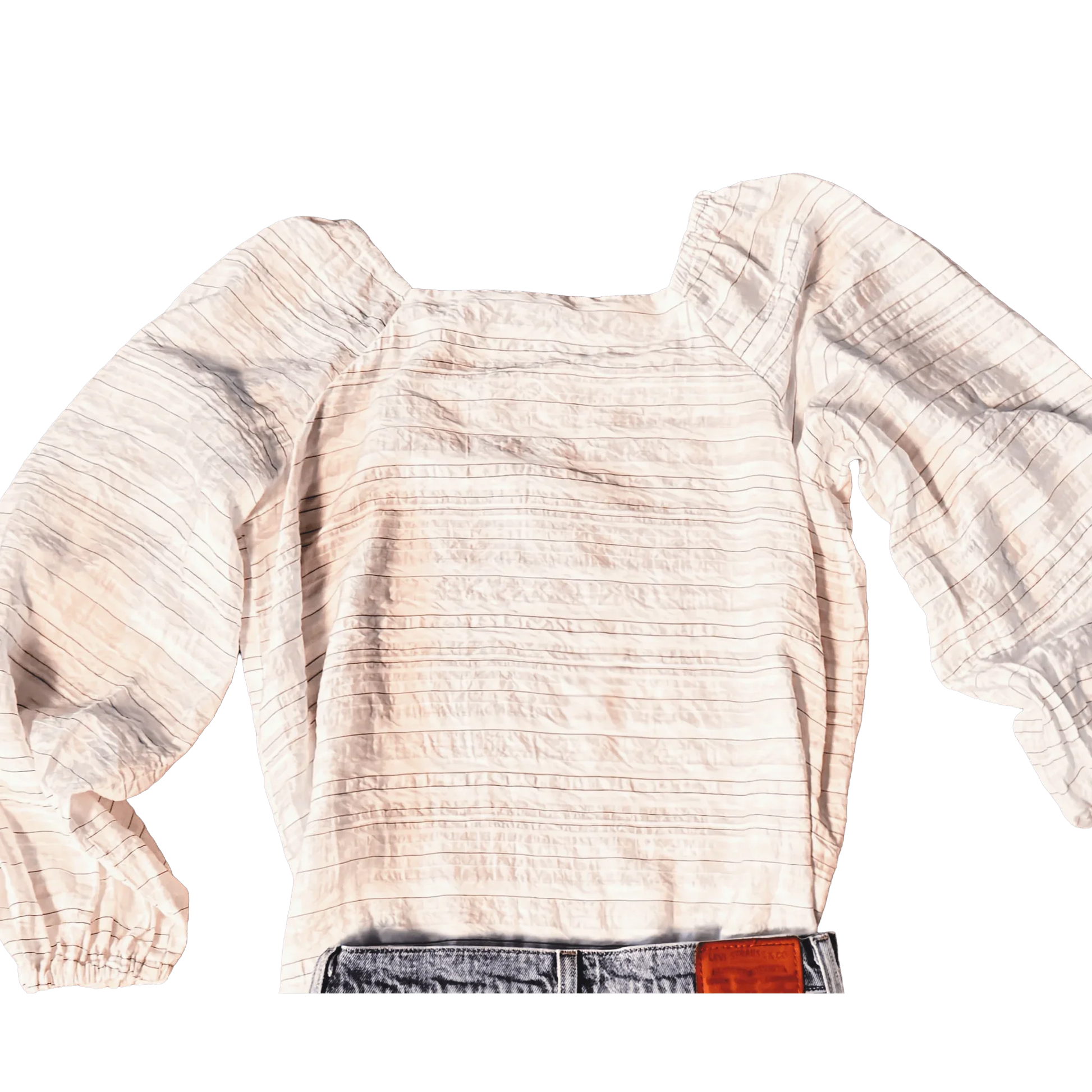 White Ann Taylor blouse with textured stripes and puffed long sleeves, paired with jeans.